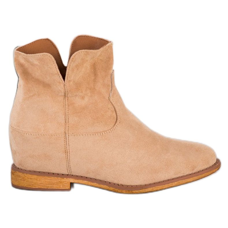 Sergio Todzi Bottes de cowboy sur un coin beige Sergio Todzi Bottes de cowboy sur un coin beige