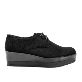 Chaussures en daim noir sur une semelle haute Elisabeth le noir