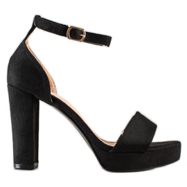 Weide Sandales noires sur un bar