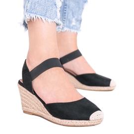 Espadrilles noires sur le coin de Louise le noir