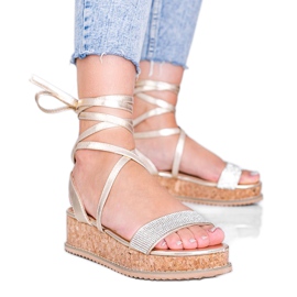 Sandales dorées nouées avec des zircons Ves