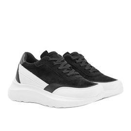 Sneakers noires avec détails blancs sur une semelle haute Barteks blanche le noir