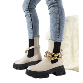 Bottes beiges avec chaîne Attention