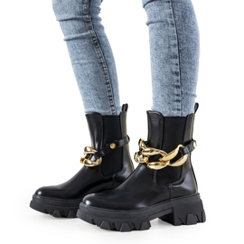 Bottines noires avec chaîne Attention le noir