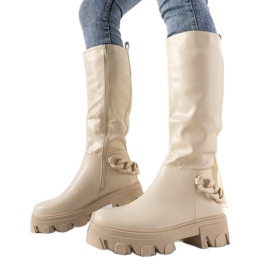 Bottes beiges avec une chaîne Conny