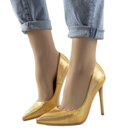 Les talons dorés irisés d'Audrey