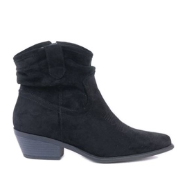 Bottes de cowboy noires sur le poteau Bowi Bowi