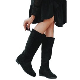 Bottes noires sur le talon compensé de Lean