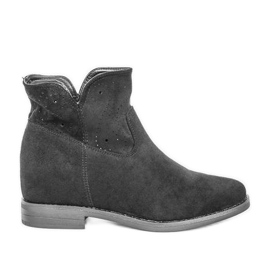 Bottes noires sur un coin intérieur Mily le noir