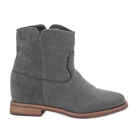 Bottes grises sur un coin intérieur Veni