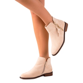 Super Me Bottes avec une fermeture éclair dorée beige