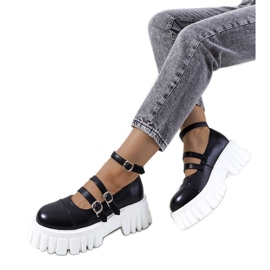 Chaussures noires sur une semelle de tracteur de Jonell le noir
