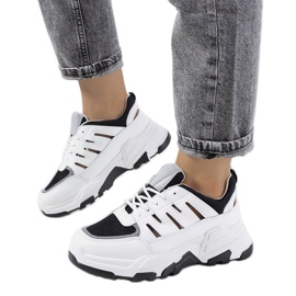 Baskets blanches à découpes de Heck noir