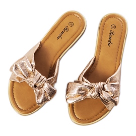 Pantoufles dorées avec un nœud Yoho rose