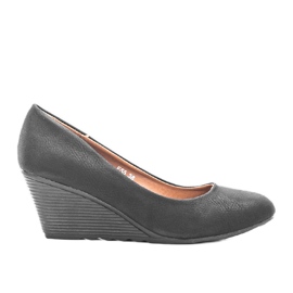 Escarpins noirs sur le coin Unies