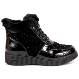 Bottes en cuir isolées en cuir noir Rieker 93312-00 sur la plate-forme le noir