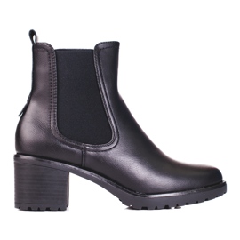 Bottines Chelsea Shelovet noires sur un poteau