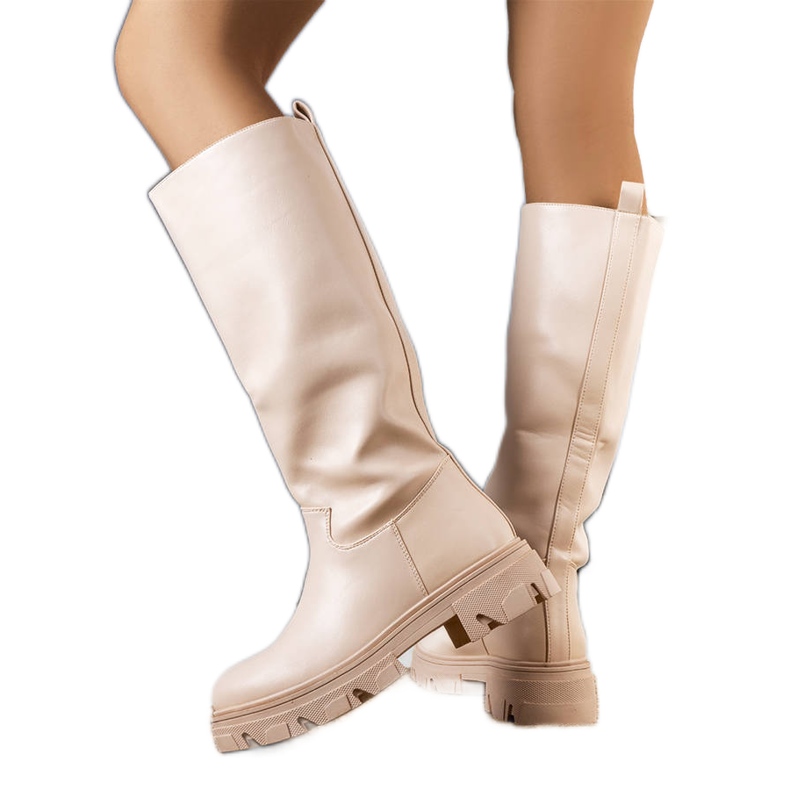 Bottes isolées beiges de Romelio