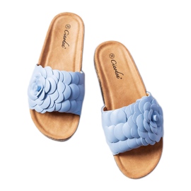 Sandales bleues ornées d'une fleur de Desaulniers
