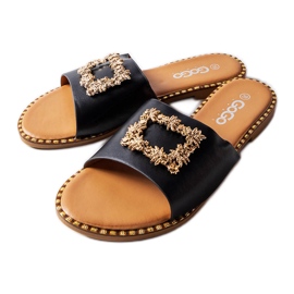 Les claquettes noires ornées de Miriam