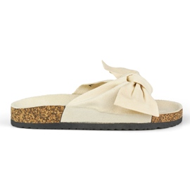 Chaussons beiges classiques avec un nœud