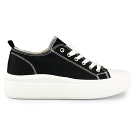 Baskets noires sur une plate-forme basse le noir
