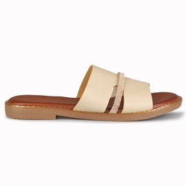 Élégantes pantoufles pour femmes beiges avec une décoration