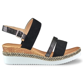 Sandales noires pour dames sur un coin bas le noir