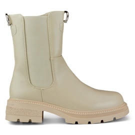Bottes classiques pour femmes beiges sur la plate-forme