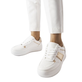 Baskets de sport blanches et dorées de Parme