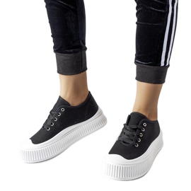 Baskets noires sur une épaisse plateforme Rina blanche le noir