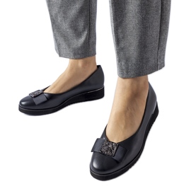 Ballerines noires avec un noeud sur la cale le noir