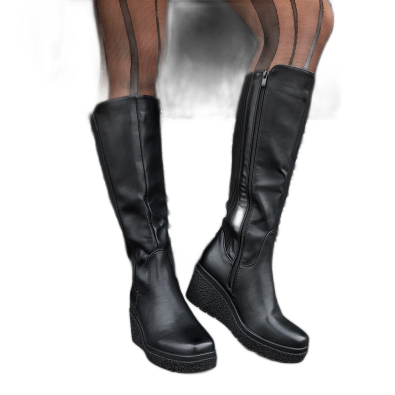 Bottes compensées noires isolées le noir