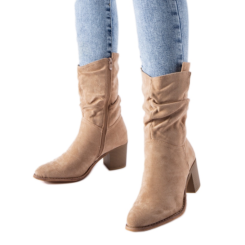 Bottes de cowboy isolées beiges de Filomena