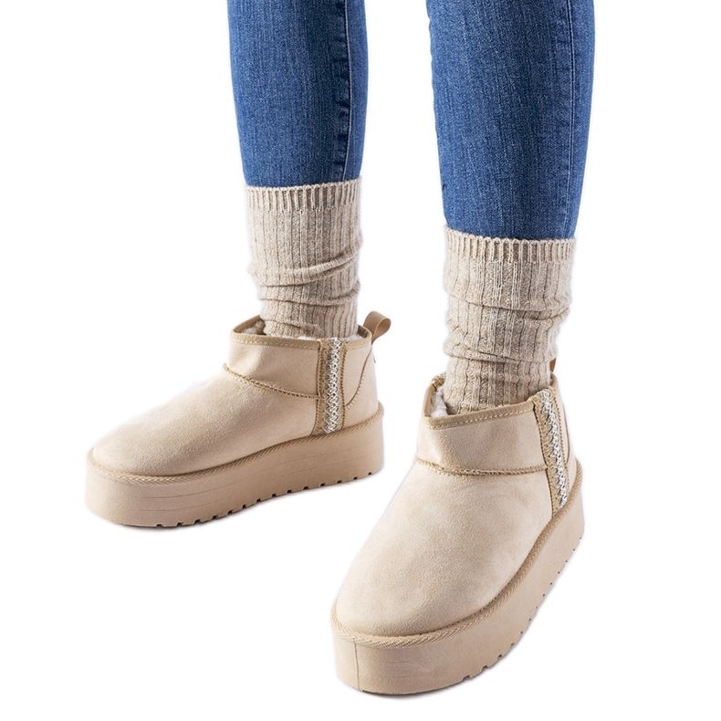 Bottes de neige beiges sur la plateforme Dennison