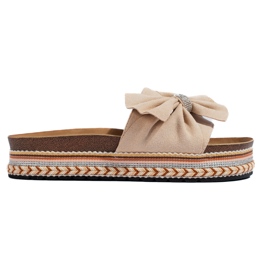 Claquettes en daim beige avec nœud