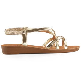 Sandales dorées pour femme à semelle plate d'or