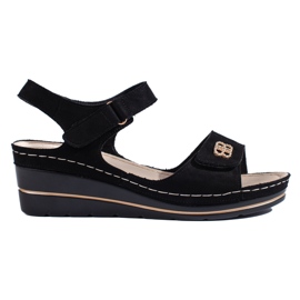 Sandales compensées en daim noir le noir
