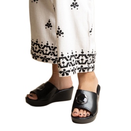 Mules compensées noires avec boucle Keirenh