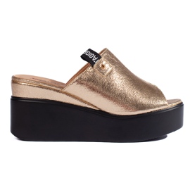 Sandales compensées dorées d'or