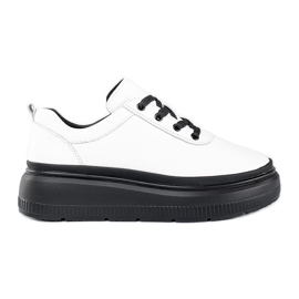 Chaussures blanches en cuir sur plateforme noire