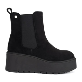 Bottines Chelsea compensées en daim noir