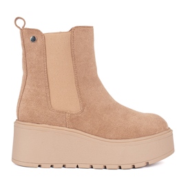 Bottines Chelsea en daim beige à semelles compensées