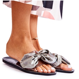 Les tongs en caoutchouc des femmes avec un arc et des zircons gris noir