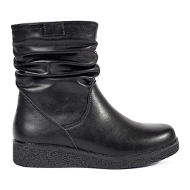 Bottines pour femmes en cuir noir sur une semelle basse avec une tige à volants par Sergio Leone le noir