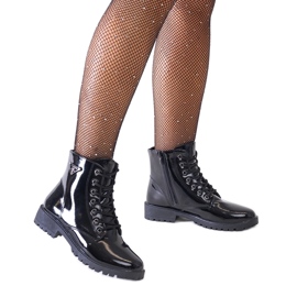 Bottines workwear brevetées noires sur la plateforme Madana le noir