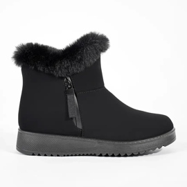 Bottes femme isolées confortables noires avec fourrure le noir