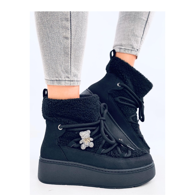 Boots de neige en peau de mouton noir le noir