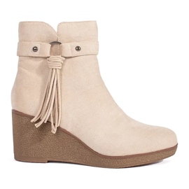 Bottines compensées femme en daim beige clair à franges