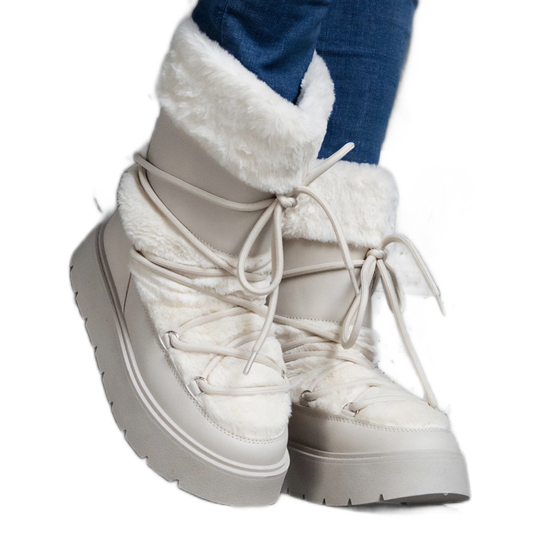 Bottes de neige à enfiler pour femme isolées beige clair ornées de fourrure